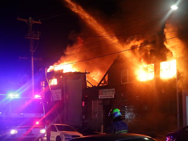 Fire has destroyed a large factory and damaged surrounding businesses on Rosedale Avenue and Beresford Avenue, Greenacre. The front walls of the building collapsed as flames roared throughout. Ten fire trucks attended the blaze. Pics Bill Hearne