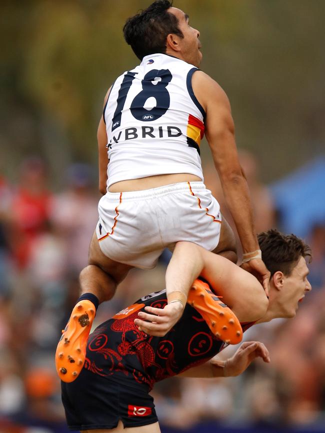 Eddie Betts of the Crows flies over Jake Lever in Alice Springs on Sunday. Picture: Michael Willson/AFL Media/Getty Images