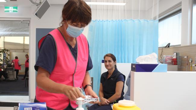 Jannelle Nichol gets one of the first Covid-19 vaccine administered at Coffs Harbour hospital's vaccination hub on Wednesday Martch 17. Photo: Tim Jarrett / Coffs Coast Advocate