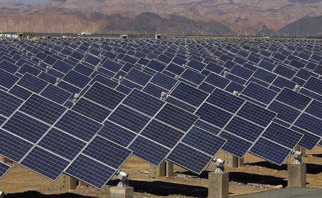 WAY OF THE FUTURE: Large solar panels are seen in a solar power plant in Hami, north-west China’s Xinjiang Uygur Autonomous Region. Picture: AFP