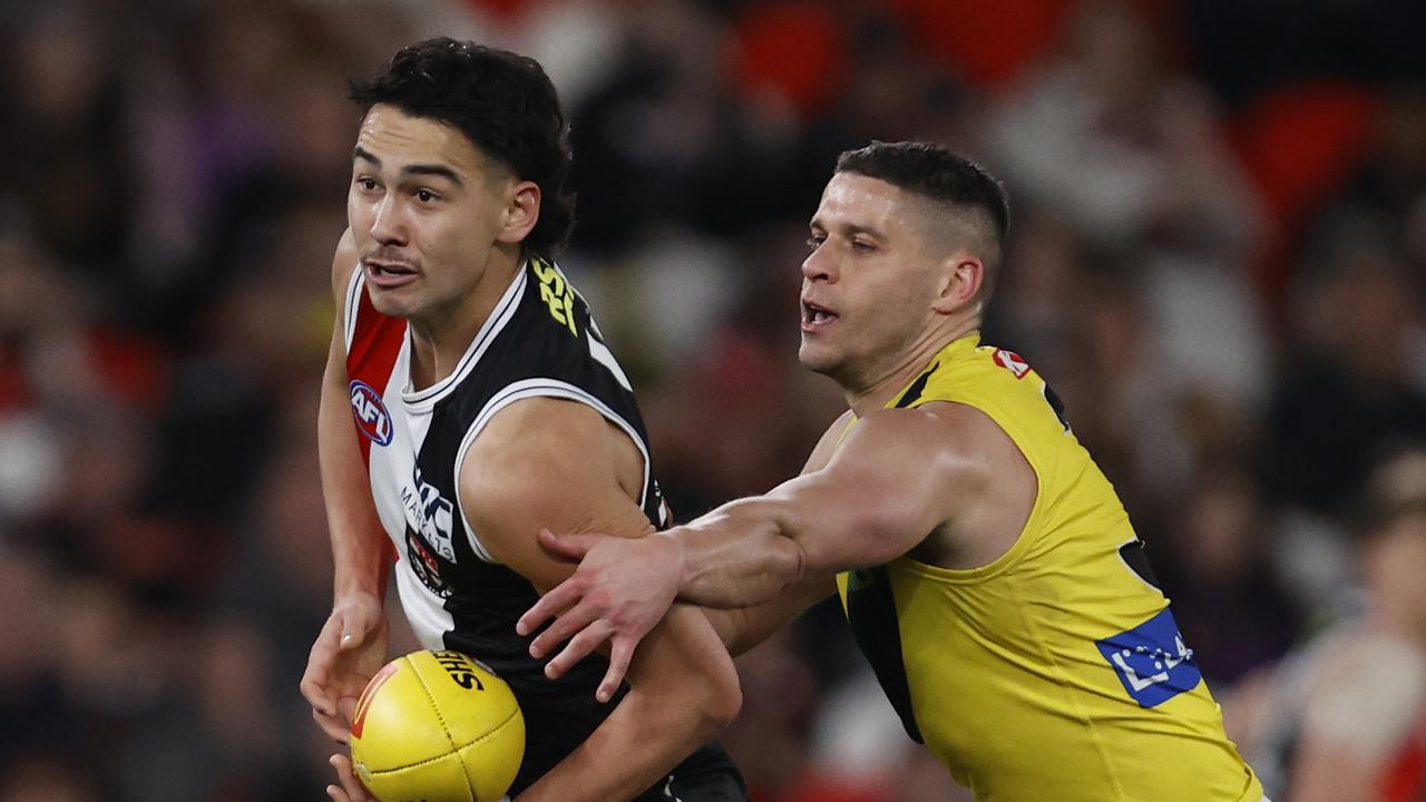 MELBOURNE, AUSTRALIA - AUGUST 13: Mitch Owens of the Saints handballs during the round 22 AFL match between St Kilda Saints and Richmond Tigers at Marvel Stadium, on August 13, 2023, in Melbourne, Australia. (Photo by Darrian Traynor/Getty Images)