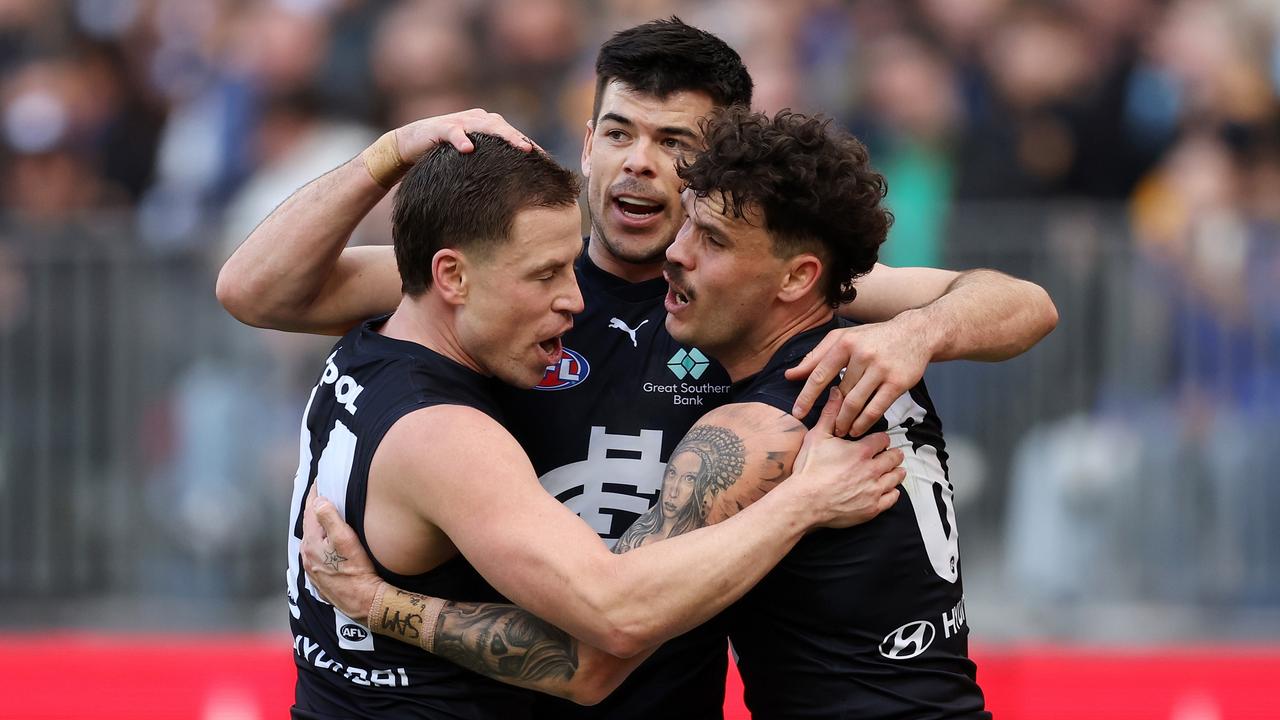 PERTH, AUSTRALIA - AUG 18: Matthew Kennedy of the Blues celebrates a goal with teammates during the 2024 AFL Round 23 match between the West Coast Eagles and the Carlton Blues at Optus Stadium on August 18, 2024 in Perth, Australia. (Photo by Will Russell/AFL Photos via Getty Images)