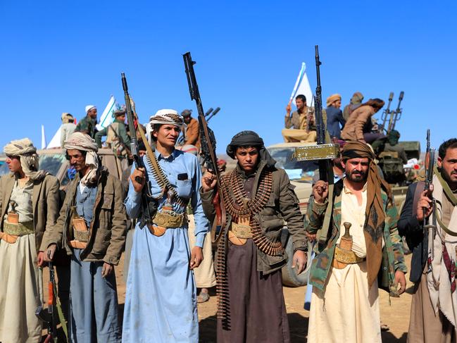 Yemeni tribal gunmen take part in a demonstration denouncing Israeli stikes and in solidarity with Palestine, in the suburbs of the Huthi-controlled capital Sanaa, on December 23, 2024. (Photo by Mohammed HUWAIS / AFP)