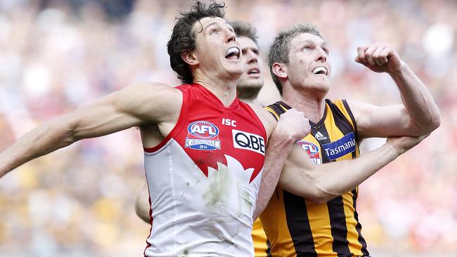 Kurt Tippett tangles with Ben McEvoy during the 2014 AFL Grand Final. Picture: David Caird