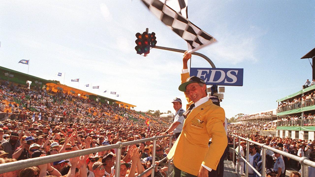 Renowned flag waver Glen Dix celebrates driver Damon Hill, winner of the 1995 Adelaide Grand Prix, the final Formula 1 race on Adelaide’s city streets.