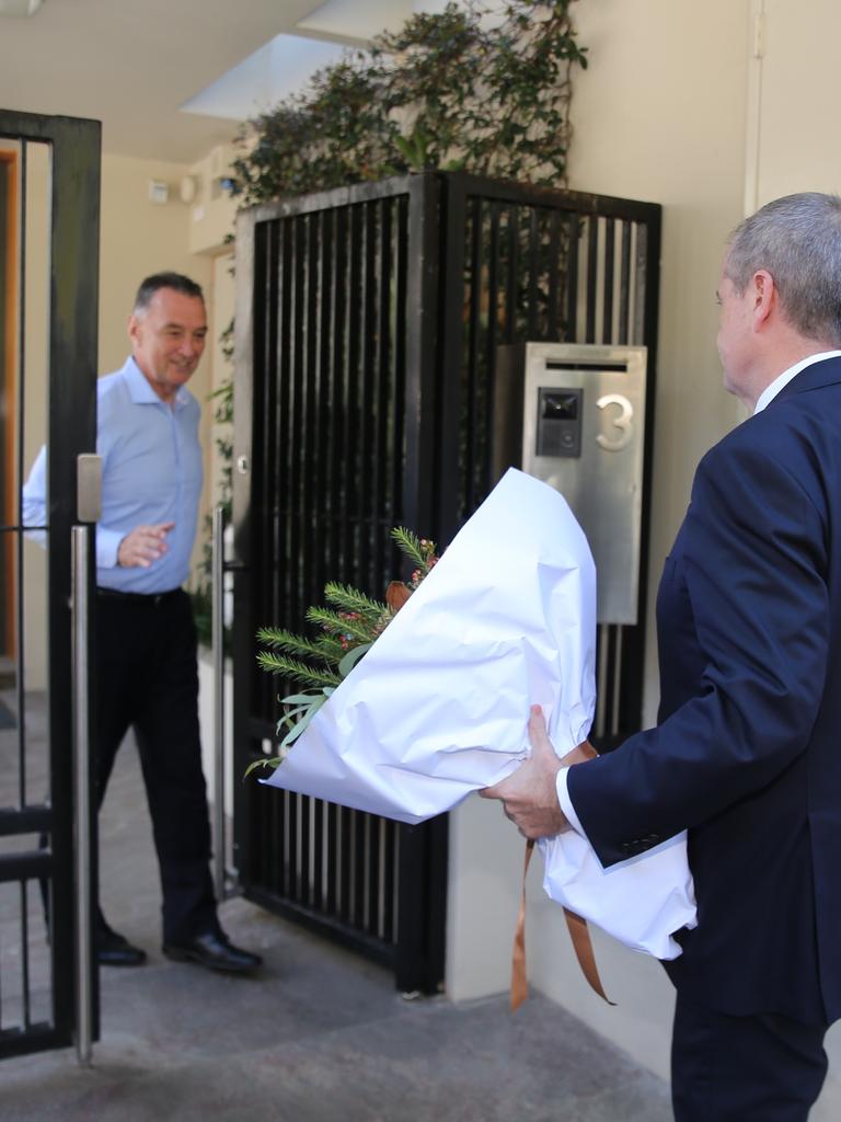 The Labor leader came bearing a bunch of flowers. Picture: John Grainger