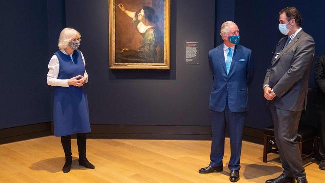 Britain’s Prince Charles (middle) and Camilla (left) view the Titian: Love, Desire, Death exhibition at the National Gallery in London. Picture: AFP