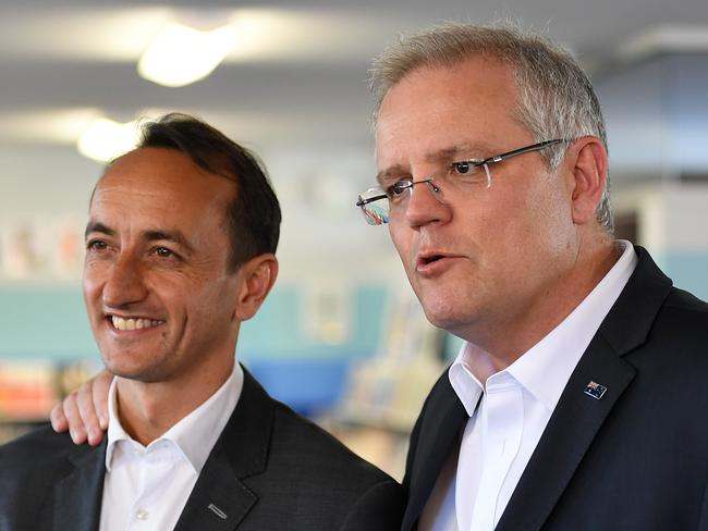 Prime Minister Scott Morrison (right) and Liberal candidate for Wentworth Dave Sharma are seen during a doorstop during a visit to Galilee Catholic Primary School in Sydney, Friday, September 21, 2018. Prime Minister Scott Morrison has struck a $4.6 billion peace deal with Catholic and independent schools, which over a decade he says will bring to an end a long-running war over the Gonski 2.0 school funding model. (AAP Image/Joel Carrett) NO ARCHIVING