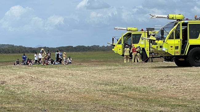 Aviation fire crews assisting volunteers simulating as crash victims. Picture: Matt Gazy