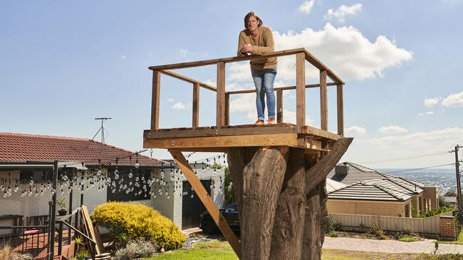 Joe Stratton outside his home in Seaview Downs, in the treehouse he’s building for his stepdaughter, Marion Council has ordered him to take it down – so he’s going to court. Picture: Matt Loxton