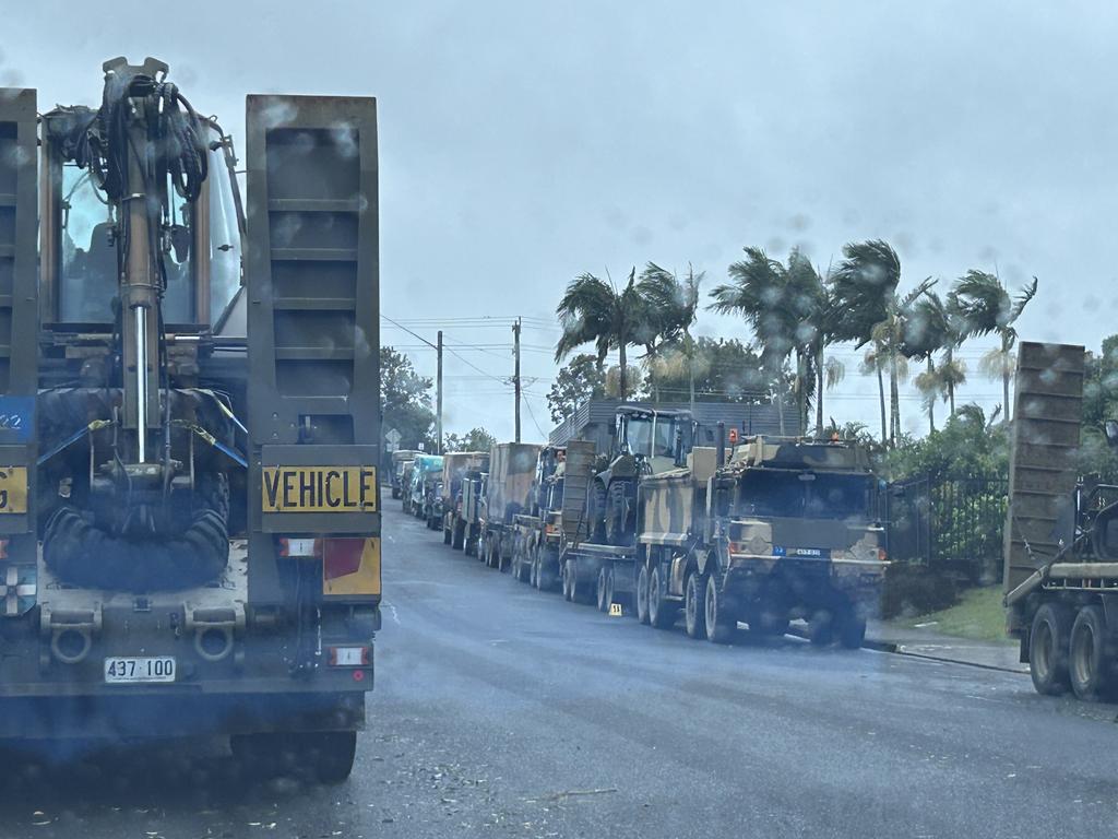 Army vehicles parked and waiting to assist along the streets of Lismore. Picture: Remy Varga