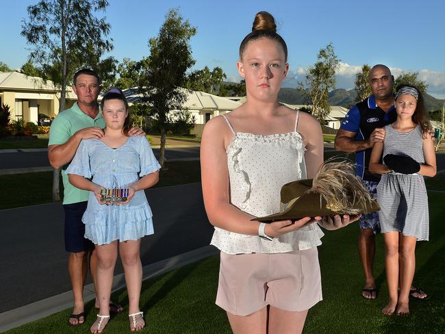 Ika Ryan, 13 with Jai Ryan, Emily Ryan, 14 and Amelia Biddle-Moro, 12 with Noel Biddle. A Mount Louisa street will have its own Anzac Day service, complete with march, under COVID-19 restrictions. PICTURE: MATT TAYLOR.