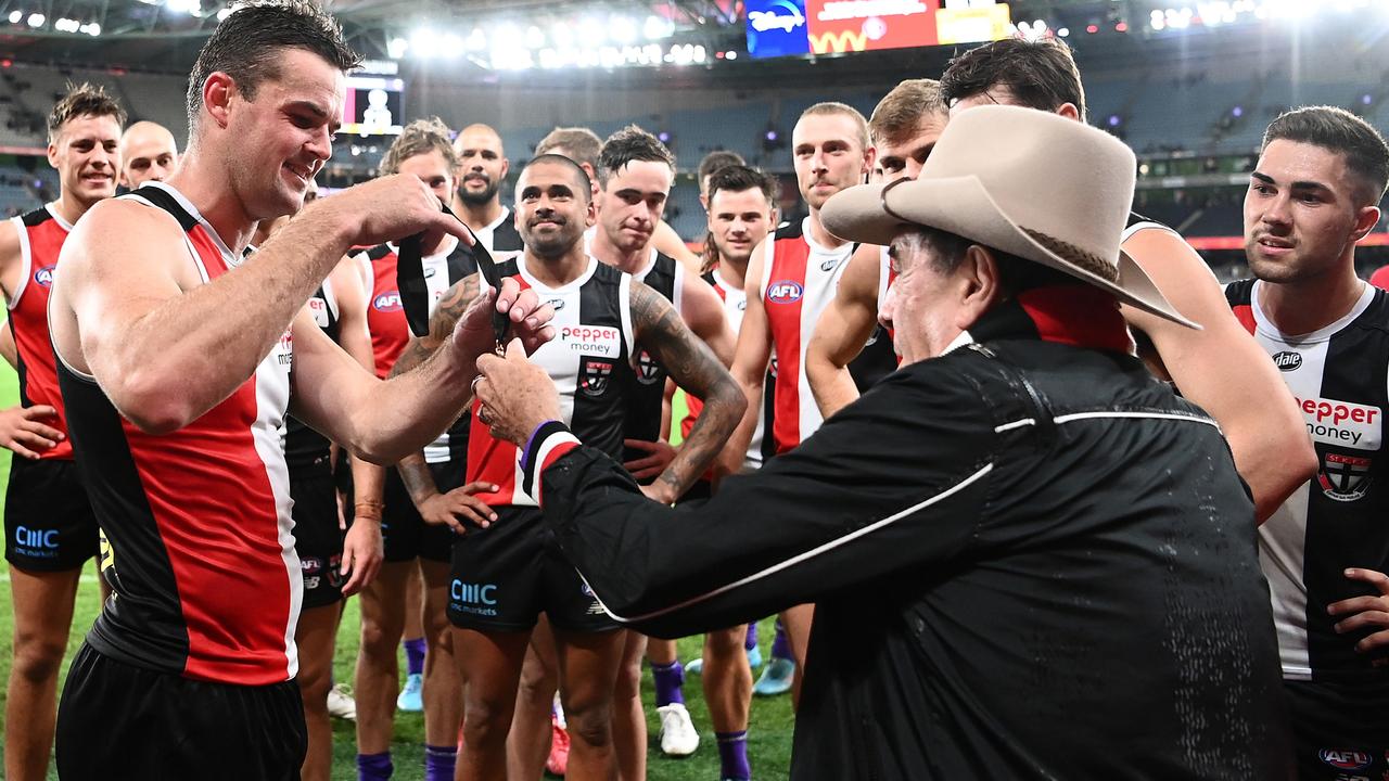 Meldrum presents Brad Crouch with his award for being best on ground. (Photo by Quinn Rooney/Getty Images)