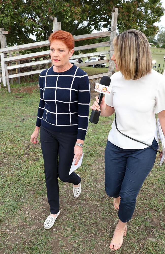 Pauline Hanson flees from reporters after a media conference. Picture: Liam Kidston.