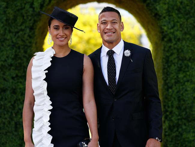 Maria Tutaia and Israel Folau pose at The Park on AAMI Victoria Derby Day at Flemington Racecourse.