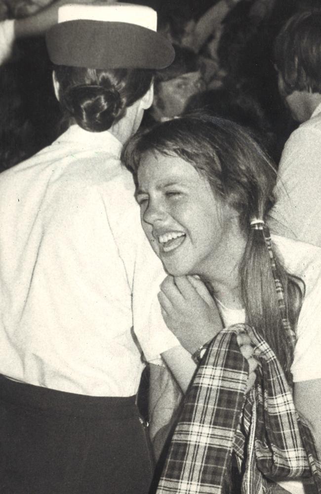 December 1975: A fan cries hysterically as a policewoman carries her from the crush during the Bay City Rollers concert at Festival Hall. Picture: Herald Sun