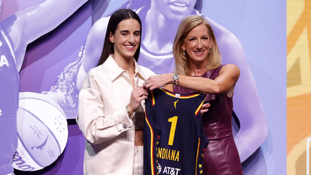 NEW YORK, NEW YORK - APRIL 15: Caitlin Clark poses with WNBA Commissioner Cathy Engelbert after being selected first overall pick by the Indiana Fever. Sarah Stier/Getty Images/AFP