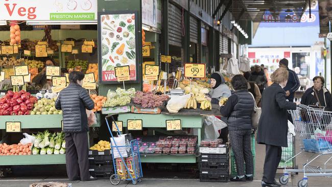 Shoppers fill their trolleys with goods at Preston Market. Picture: Ellen Smith