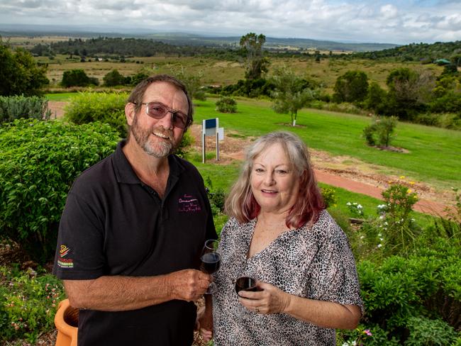 Crane Winery owners and winemakers Bernie and Judy Cooper celebrate their retirement, April 8, 2022, at their vineyard near Kingaroy. Picture: Dominic Elsome