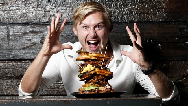 Jack Houghton with Ze Pickle’s Shut the F — k Up burger. Picture: JERAD WILLIAMS