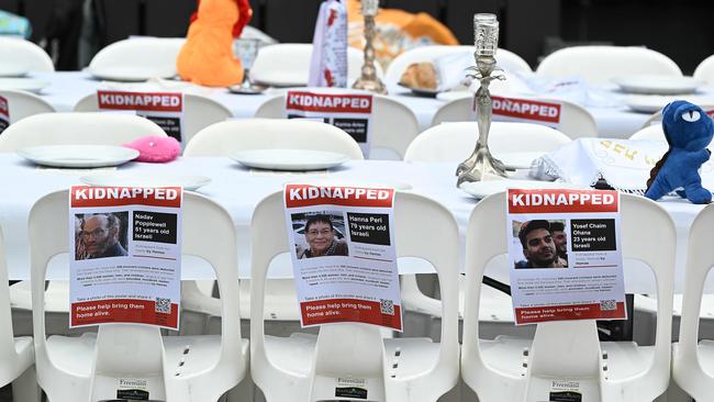 Kidnapped names at a Shabbat table installation, to acknowledge the 220 hostages being held by Hamas, in King George Square, Brisbane. Picture: Lyndon Mechielsen/Courier Mail