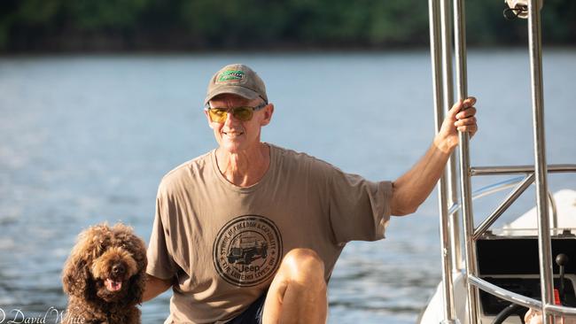 Daintree River wildlife expert David White, owner of Solar Whisper Crocodile and Wildlife Cruises, with his trusty dog Doug. Picture: Supplied