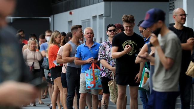 Hundreds of people line up to get into Woolworths at Gasworks Plaza in Newstead after it was announced Greater Brisbane will go into lockdown for 3 days from 6pm. Pics Adam Head