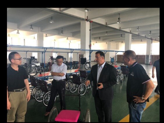 Mr Moselmane and academic Li Jianjun (left), who had his visa cancelled by ASIO, on site in at a factory in China. Picture: Supplied.