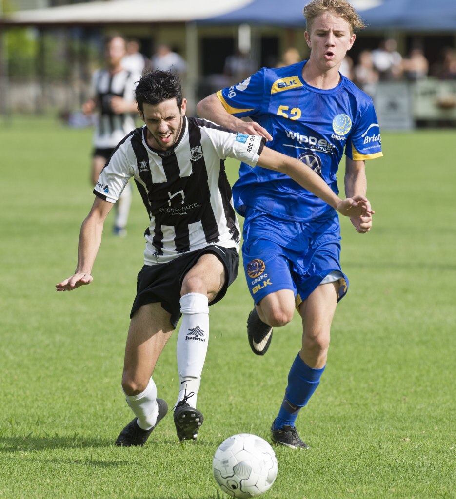 Callum Hart, Willowburn and Cormac McCarthy, USQ. Football, Willowburn vs USQ. Sunday, 4th Mar, 2018. Picture: Nev Madsen