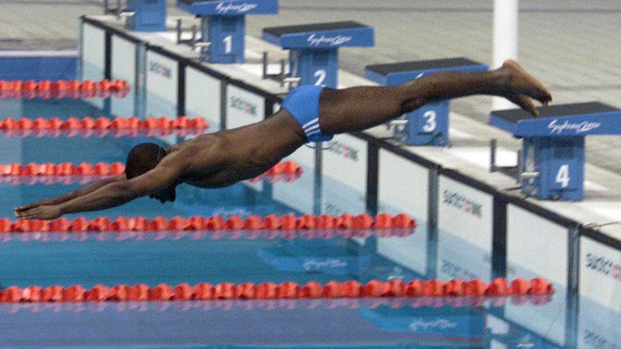 Eric Moussambani swims into cult hero status.