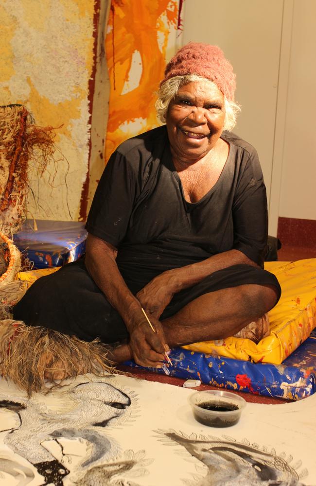 SA artist Iluwanti Ken, from Amata, works on one of her ink drawing of mother eagles. Picture: Tjala Arts