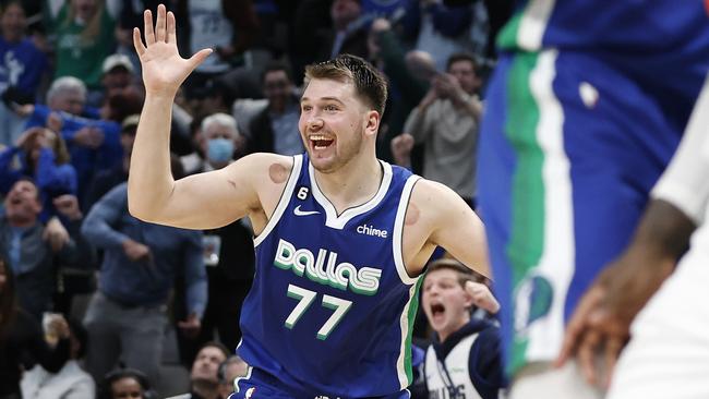 DALLAS, TEXAS - DECEMBER 27: Luka Doncic #77 of the Dallas Mavericks reacts after making the game tying basket against the New York Knicks with one second left in regulation to send the game to overtime at American Airlines Center on December 27, 2022 in Dallas, Texas. NOTE TO USER: User expressly acknowledges and agrees that, by downloading and or using this photograph, User is consenting to the terms and conditions of the Getty Images License Agreement. (Photo by Tim Heitman/Getty Images)