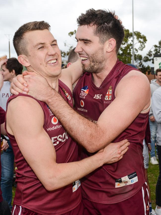 Trengove celebrates with teammate Cameron Giles after Saturday’s grand final win. Picture: Brenton Edwards