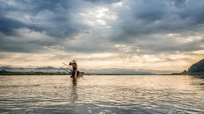 A fisherman on the Mekong River in Vietnam.