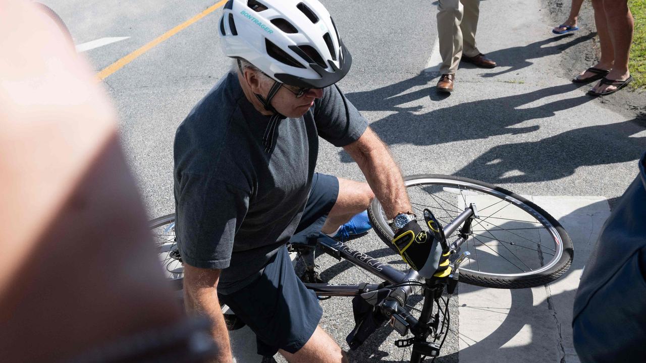 US President Joe Biden falls off his bicycle. Picture: Saul Loeb/AFP