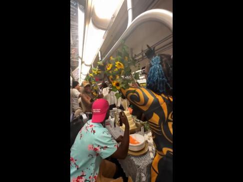 Newly-wed couple has wedding reception on subway train