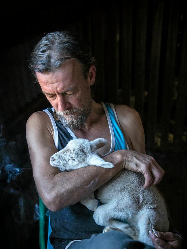 A quiet moment between Luke Churchward and a lamb. Picture: Chantel Renae Photography