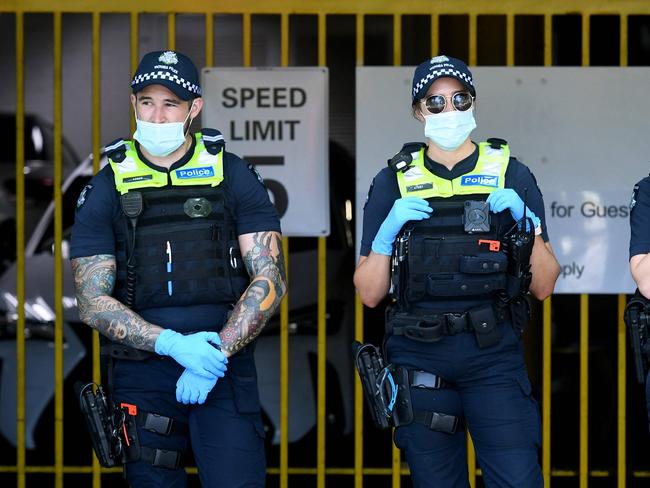 Police wearing masks and gloves while on patrol. Picture: William West