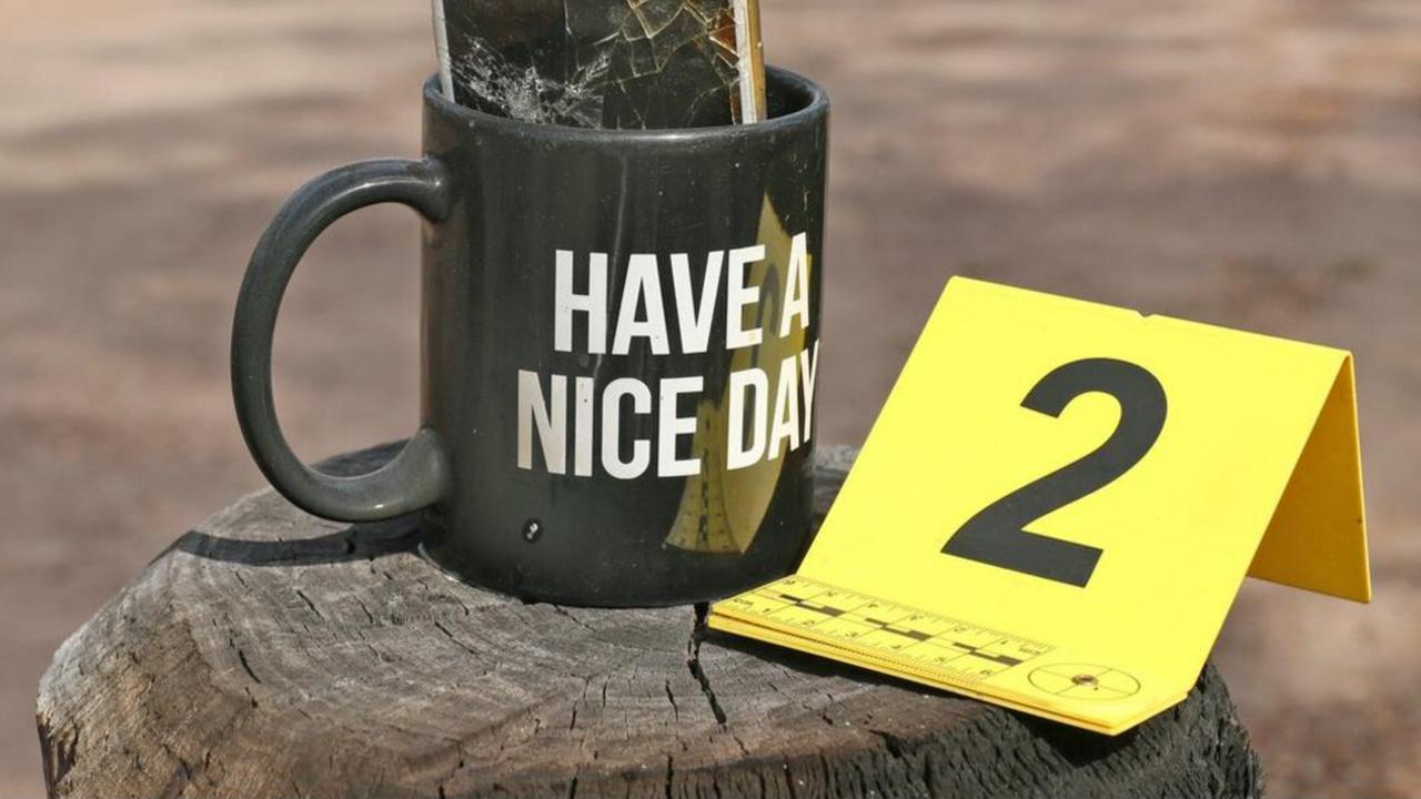 A mug printed with the words ‘Have a Nice Day’ was found attached to the Trains’ letterbox. It contained a smashed iPhone that had an expletive word printed at the top. Picture: Supplied