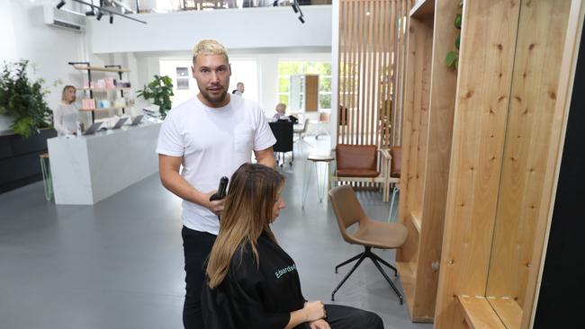 Jaye Edwards with Elle Martin in the hairdressers chair at Edward and Co on Crown St in Surry Hills. Picture Rohan Kelly