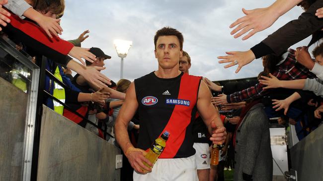 Essendon champion Matthew Lloyd walks off the ground after what turned out to be his 270th and final game - in Round 22, 2009.