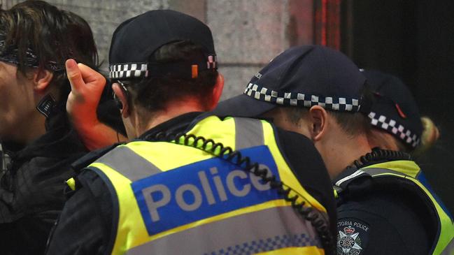 Victoria Police arrest a man at Flinder’s Street on NYE. Picture: Jay Town