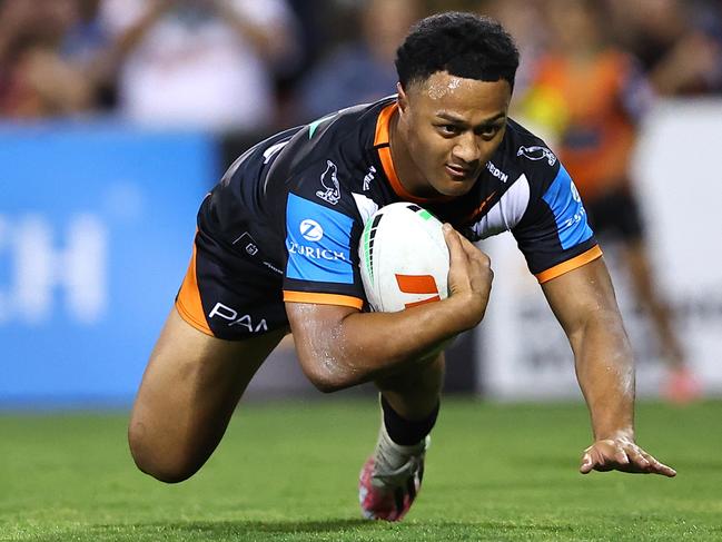 Former Sea Eagle Latu Fainu dives across the line for Wests Tigers. (Photo by Jeremy Ng/Getty Images)