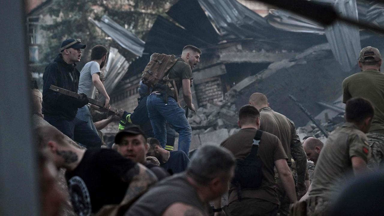 Rescuers and volunteers work to rescue people from under the rubble after a Russian missile strike hit a restaurant and several houses in Kramatorsk, eastern Ukraine. Picture: Genya Savilov/AFP