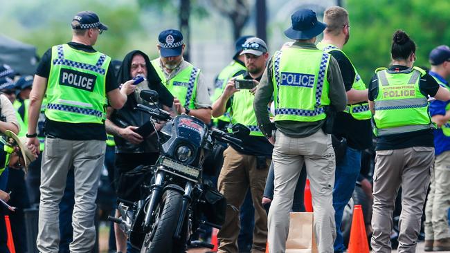 Officers stop members of the bikie gang. Picture: Glenn Campbell