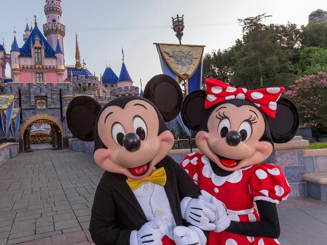 ESCAPE:  Standing in front of Sleeping Beauty Castle at Disneyland Park, Mickey Mouse and Minnie Mouse welcome visitors from all over the world. Combining classic favorites and exciting additions, the Disneyland Resort is an essential part of a Southern California vacation. (Joshua Sudock/Disneyland Resort)