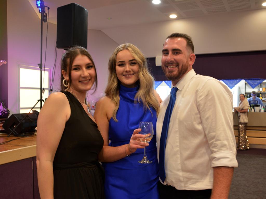 Joy (L), Tiarna and Sam (R) ready to boogie at Warwick's Coppers Ball charity event on Saturday night.