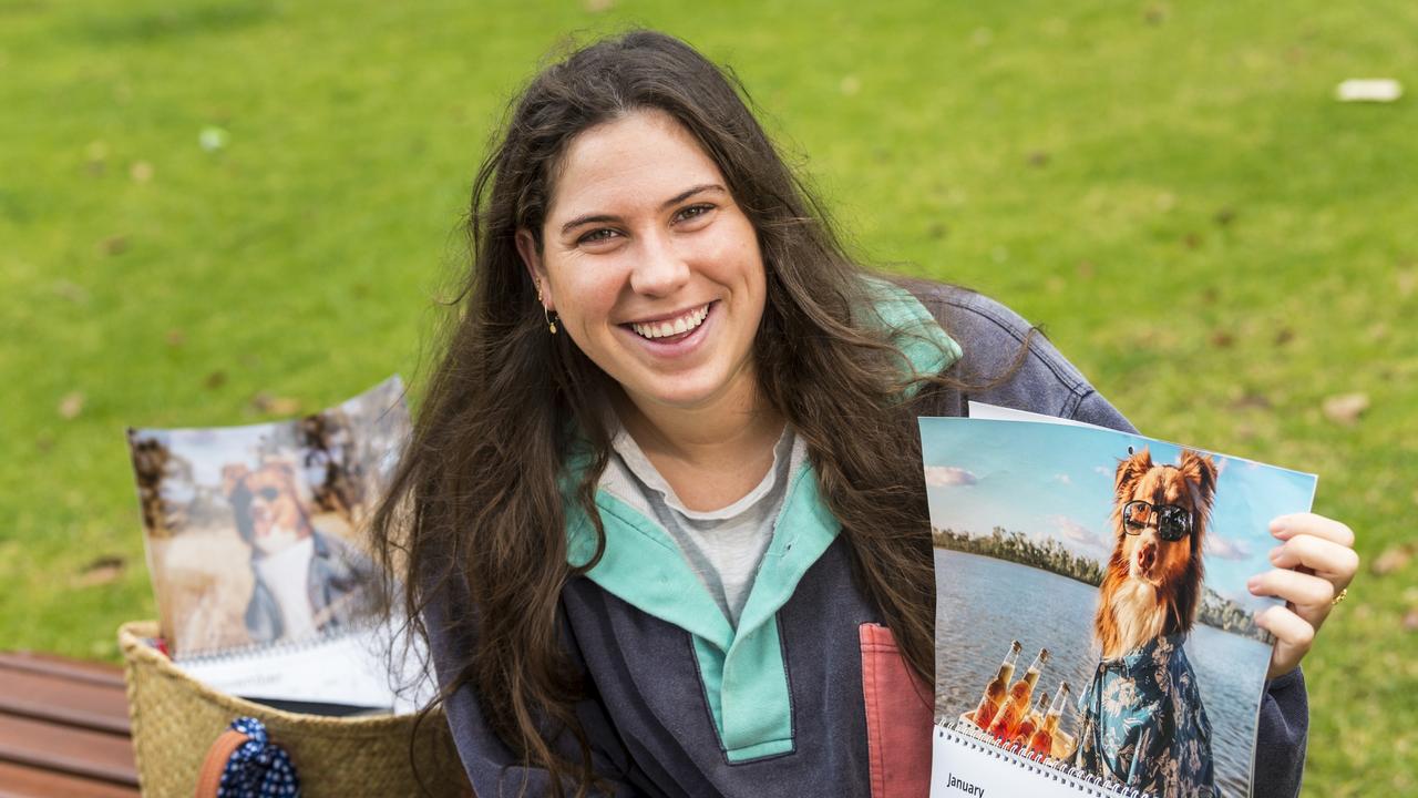 Darby Brown with her Calendars Fighting Cancer calendars featuring her brother's dog Austin produced to raise money for the Melanoma Institute Australia in memory of her sister-in-law. Picture: Kevin Farmer