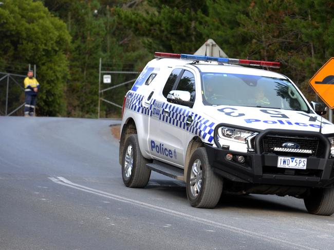 A single staffer stands guard at the entrance of the mine. Picture: Andrew Henshaw