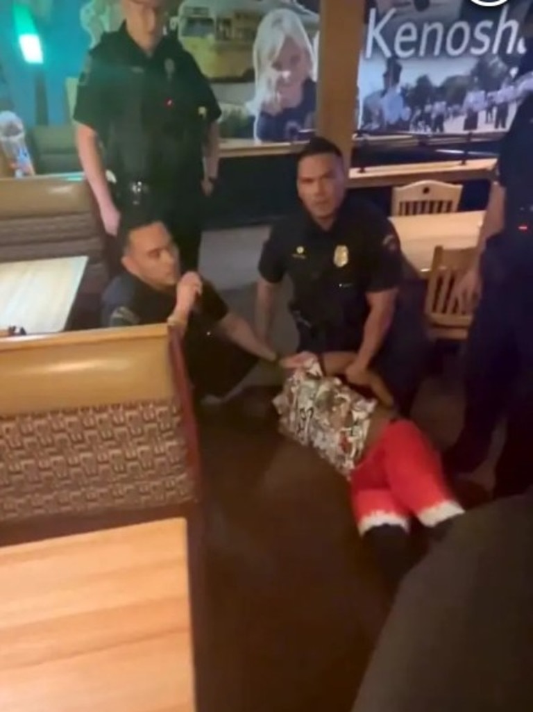 After the child was taken away, officers’ pinned him to the floor. Picture: Hal Mudge/Facebook